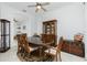 Dining area with wooden table and chairs, and access to the living room at 4401 Boeing Ln, North Port, FL 34287