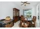 Bright dining room, featuring a wooden table and chairs, and access to the backyard at 4401 Boeing Ln, North Port, FL 34287