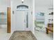 Bright entryway with tiled floors and a comfortable rocking chair at 4401 Boeing Ln, North Port, FL 34287