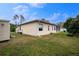 Well-maintained house exterior with a large backyard at 4401 Boeing Ln, North Port, FL 34287