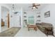 Bright living room with tiled floors, comfy seating, and built-in shelving at 4401 Boeing Ln, North Port, FL 34287