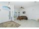 Living room with tiled floors, a plaid couch, and a coffee table at 4401 Boeing Ln, North Port, FL 34287