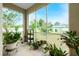 Spacious screened porch featuring many potted plants at 4401 Boeing Ln, North Port, FL 34287