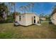 Tan colored storage shed with ramp access at 4401 Boeing Ln, North Port, FL 34287