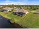 Aerial view highlighting the pool, backyard, and canal view at 45 Marker Rd, Rotonda West, FL 33947