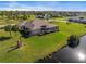 Aerial view showcasing the home's pool and canal-front location at 45 Marker Rd, Rotonda West, FL 33947