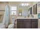 Clean bathroom with a shower/tub combo and dark brown vanity at 45 Marker Rd, Rotonda West, FL 33947