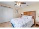 Guest bedroom with a comfortable bed and ceiling fan at 45 Marker Rd, Rotonda West, FL 33947