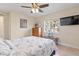 Bright bedroom with a starfish comforter and flat-screen TV at 45 Marker Rd, Rotonda West, FL 33947