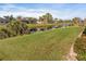 Peaceful view of a canal with lush greenery and homes at 45 Marker Rd, Rotonda West, FL 33947