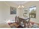 Bright dining room with hardwood floors and large windows at 45 Marker Rd, Rotonda West, FL 33947