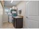 Convenient laundry room with washer, dryer and storage at 45 Marker Rd, Rotonda West, FL 33947