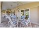 Outdoor patio with table and chairs, adjacent to the pool at 45 Marker Rd, Rotonda West, FL 33947