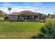 Relaxing pool area with screened enclosure and ample yard space at 45 Marker Rd, Rotonda West, FL 33947