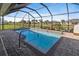 Refreshing pool with a screened enclosure and patio at 45 Marker Rd, Rotonda West, FL 33947