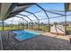 Enclosed pool with a spacious patio and a clear view at 45 Marker Rd, Rotonda West, FL 33947