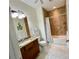 Bathroom features granite vanity, toilet and shower/tub combo at 4530 Turnberry Cir, North Port, FL 34288