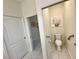 Small bathroom with toilet and grab bar at 4530 Turnberry Cir, North Port, FL 34288