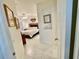 Main bedroom with a king-size bed and access to the bathroom at 4530 Turnberry Cir, North Port, FL 34288