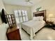 Bright bedroom with a queen-size bed and TV at 4530 Turnberry Cir, North Port, FL 34288