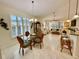 Open concept dining and living room with tile floors at 4530 Turnberry Cir, North Port, FL 34288