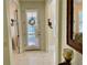 View of entryway with white door and tile floors at 4530 Turnberry Cir, North Port, FL 34288