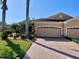 Beautiful home with two-car garage and landscaped front yard at 4530 Turnberry Cir, North Port, FL 34288