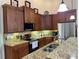 Well-equipped kitchen boasting granite counters and ample cabinetry at 4530 Turnberry Cir, North Port, FL 34288