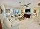 Spacious living area featuring white leather furniture at 4530 Turnberry Cir, North Port, FL 34288