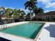 Community pool with surrounding patio and landscaping at 4530 Turnberry Cir, North Port, FL 34288