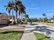 Residential street with palm trees and homes at 4530 Turnberry Cir, North Port, FL 34288