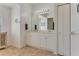 Double vanity bathroom with large mirror and tiled floor at 4607 Sabrina Ter, North Port, FL 34286