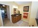 Bathroom with single sink vanity, granite countertop, and a view of the bedroom at 506 Monaco Dr, Punta Gorda, FL 33950