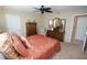 Spacious bedroom with a queen-size bed, dresser, and ceiling fan at 506 Monaco Dr, Punta Gorda, FL 33950