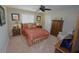 Bedroom with comfortable bed, ceiling fan, and ample closet space at 506 Monaco Dr, Punta Gorda, FL 33950