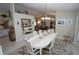 Bright dining room with an oval table and view into the kitchen at 506 Monaco Dr, Punta Gorda, FL 33950