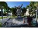 Native American wood carving in a fenced area near homes at 506 Monaco Dr, Punta Gorda, FL 33950