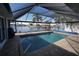 Relaxing screened pool and patio area with canal views at 506 Monaco Dr, Punta Gorda, FL 33950