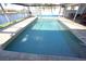 Inviting pool area with spacious patio and screened enclosure at 506 Monaco Dr, Punta Gorda, FL 33950