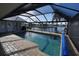 Enclosed pool area with water views and brick pavers at 506 Monaco Dr, Punta Gorda, FL 33950