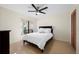 Bright bedroom with a queen bed and ceiling fan at 5089 San Rocco Ct, Punta Gorda, FL 33950