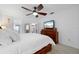 Main bedroom with king-size bed and en-suite bathroom access at 5089 San Rocco Ct, Punta Gorda, FL 33950