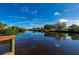 Serene waterway view with lush vegetation and clear reflections at 5089 San Rocco Ct, Punta Gorda, FL 33950