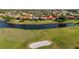 Aerial view of upscale community near golf course at 5625 Whispering Oaks Dr, North Port, FL 34287