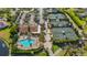 Community features tennis courts, pool, and clubhouse at 5625 Whispering Oaks Dr, North Port, FL 34287