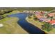 Aerial view of golf course and waterfront homes at 5625 Whispering Oaks Dr, North Port, FL 34287