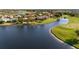 Aerial view of waterfront homes and golf course at 5625 Whispering Oaks Dr, North Port, FL 34287