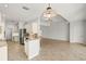 Well-equipped kitchen with light-colored cabinetry and a breakfast bar at 5625 Whispering Oaks Dr, North Port, FL 34287