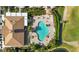 Community pool and clubhouse view from above at 5625 Whispering Oaks Dr, North Port, FL 34287