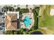 Resort-style pool with lounge chairs and clubhouse at 5625 Whispering Oaks Dr, North Port, FL 34287